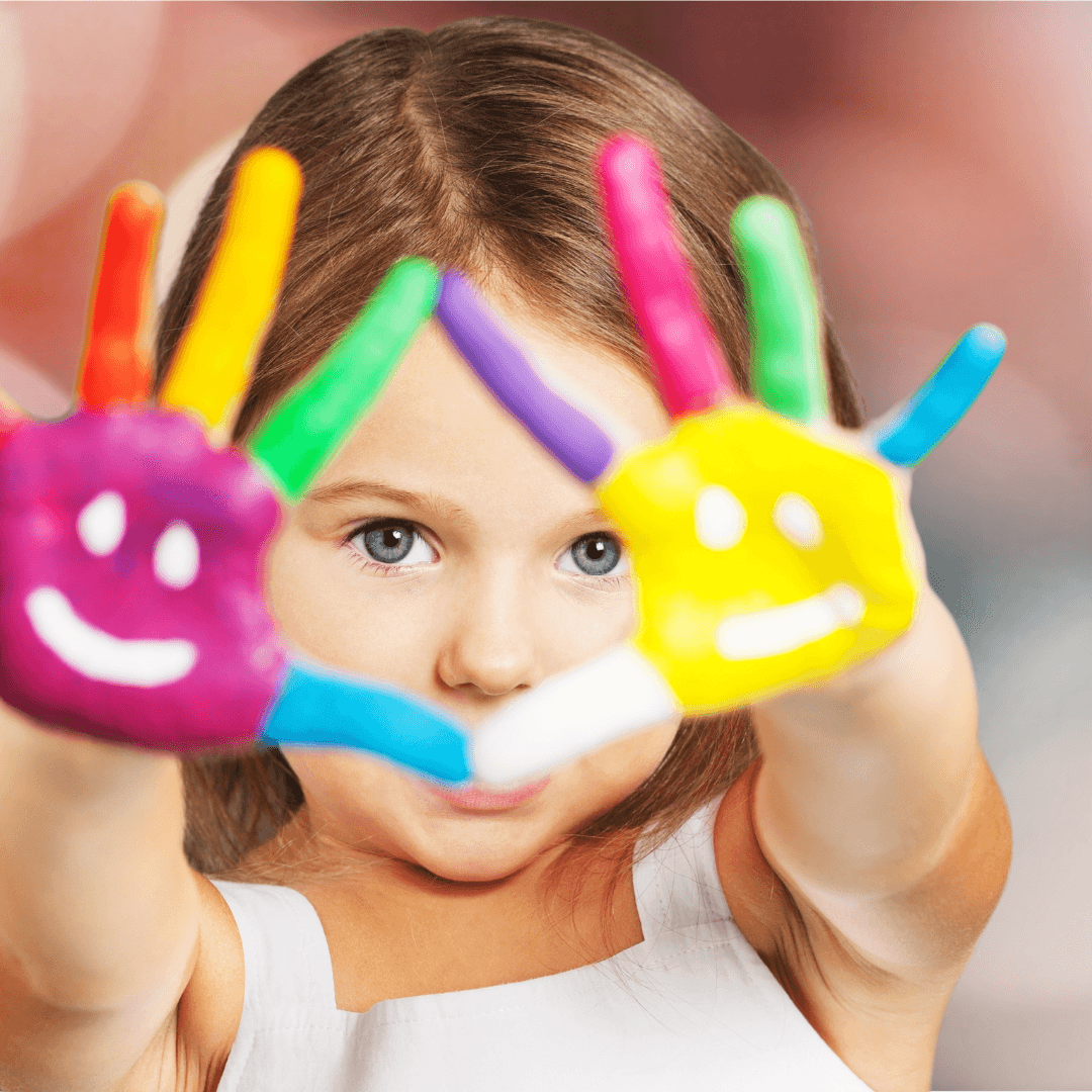 kid showing painted hands