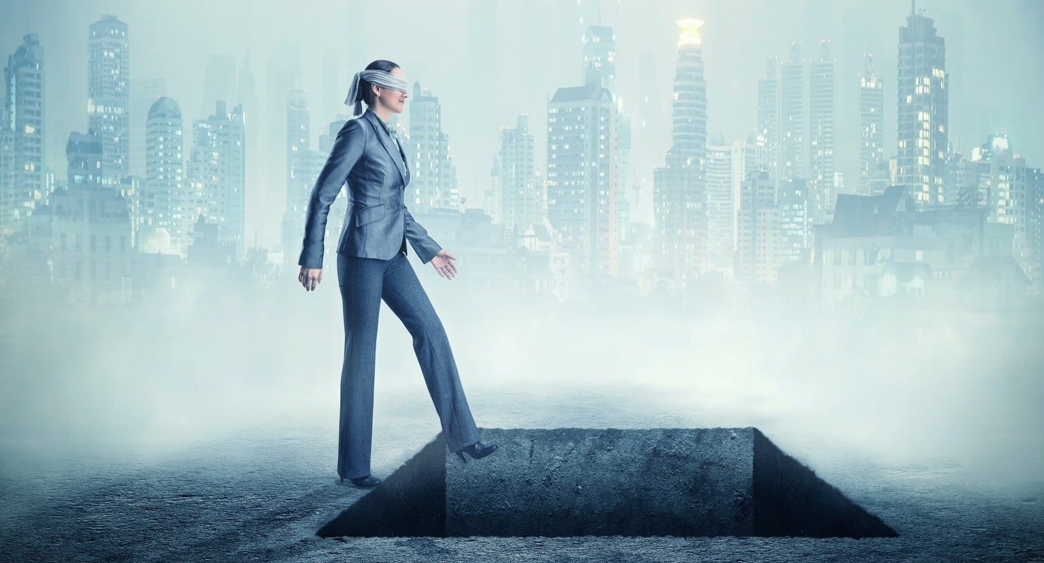 person walking with the eyes covered by a blindfold, with a city on the background